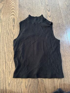 Black sleeveless turtleneck top